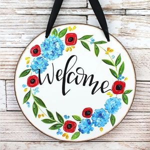 Floral Welcome Sign with Red and Blue Accents